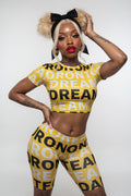 Women's Biker Shorts — Bold Repeat 'REANT' Graphic Yellow Print